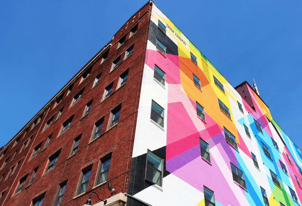 a tall building with graffiti on the side of it