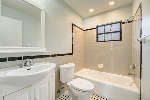 Renovated Apartment Home Bathroom at The Flats at Seminole Heights at 4111 N Poplar Ave in Tampa, FL