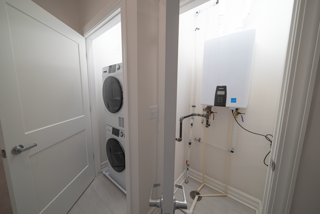 a small laundry room with a washing machine and a dryer