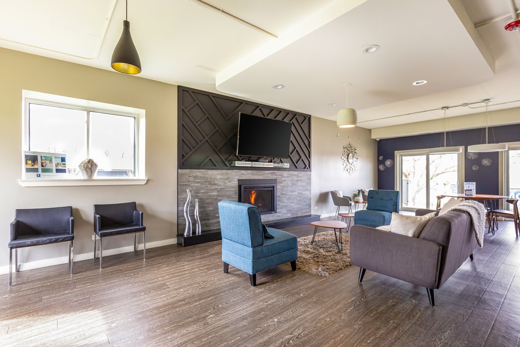 A living room with a fireplace and a television.