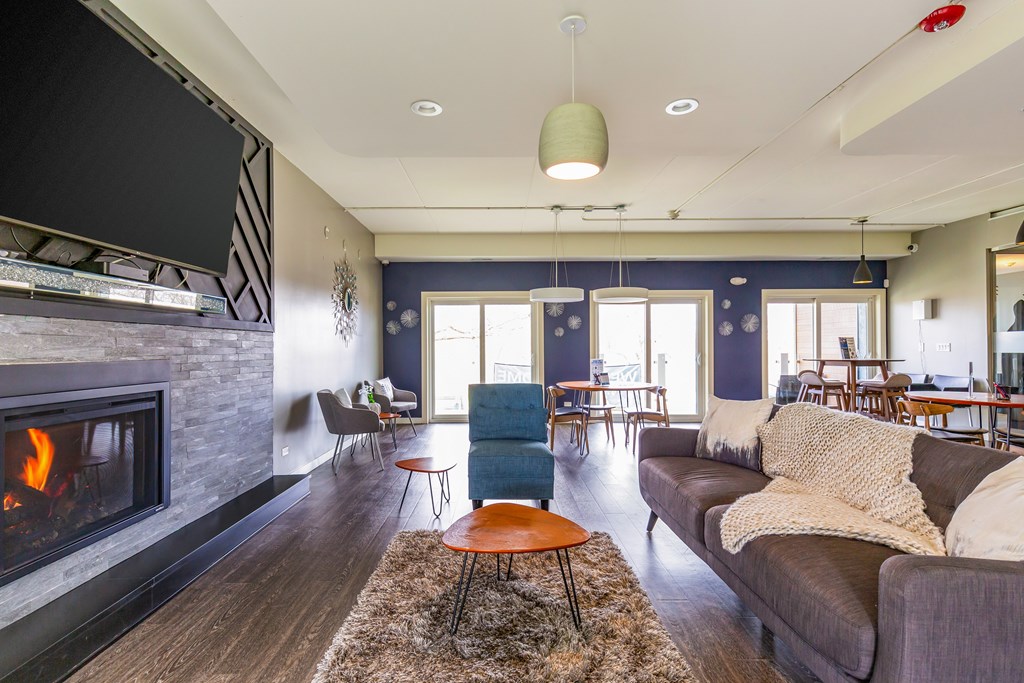 A living room with a fireplace and a couch.