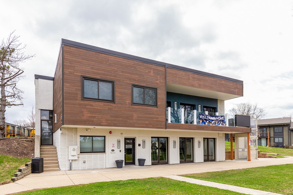 A modern building with a brown and white exterior.