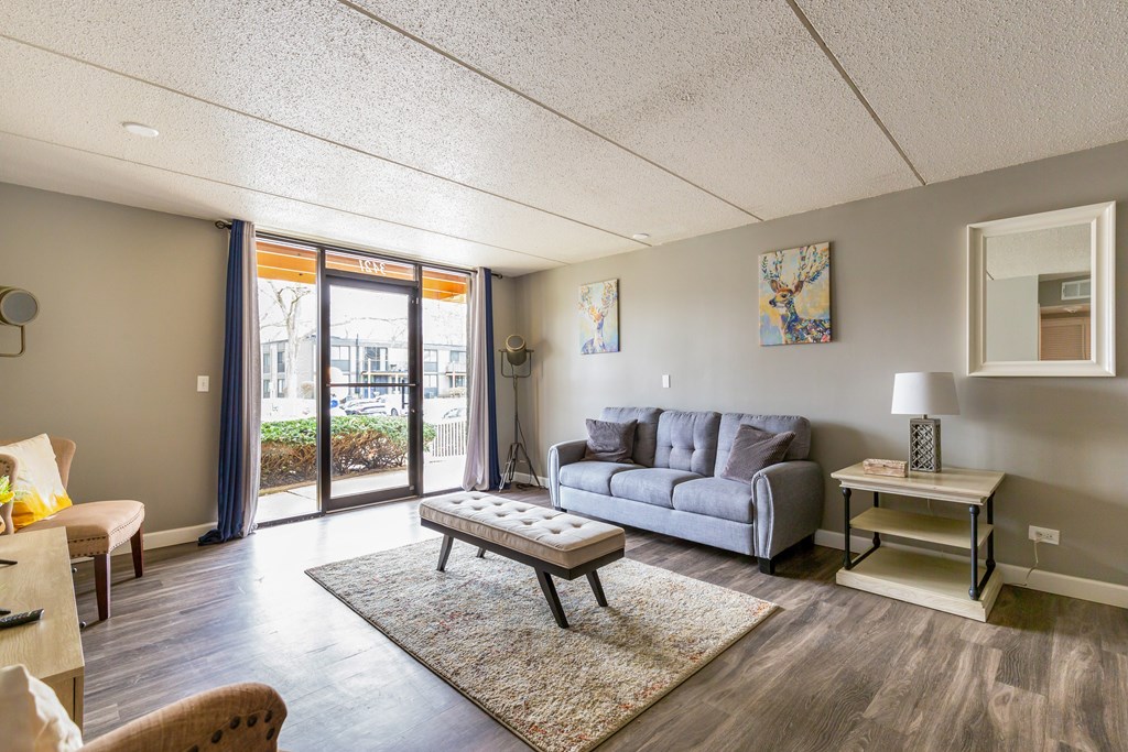 A living room with a grey sofa and a coffee table.