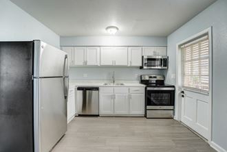 Renovated Apartment Home Kitchen at The Flats at Seminole Heights at 4111 N Poplar Ave in Tampa, FL