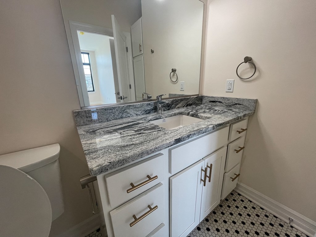 an empty bathroom with a sink and a toilet