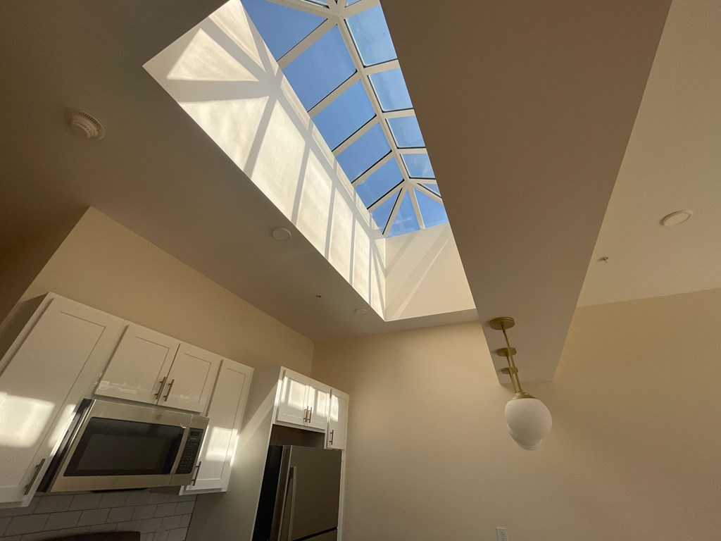 a skylight in the ceiling of a kitchen