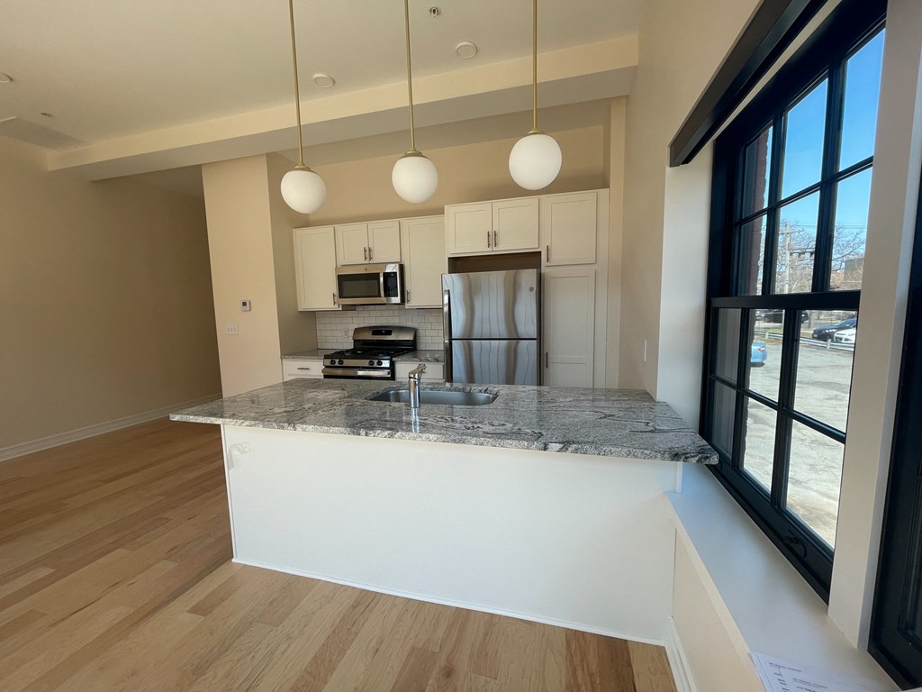 a kitchen with a granite counter top and a sink