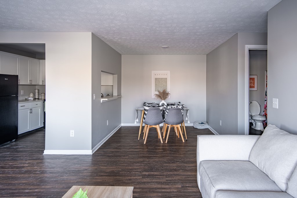 A modern kitchen with a dining table set for two at Centerpointe Apartments, Canandaigua, 14424