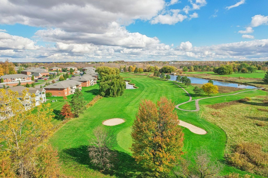 A golf course with a river running through it.