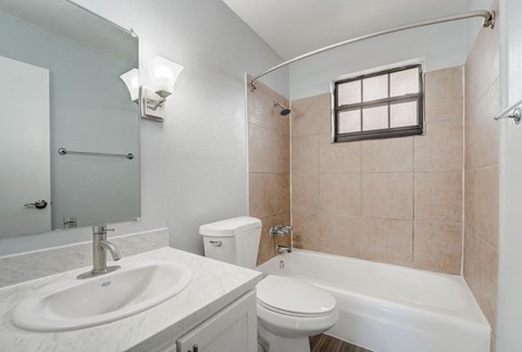 Renovated Apartment Home Bathroom at The Flats at Seminole Heights at 4111 N Poplar Ave in Tampa, FL