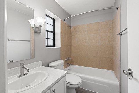 Large Soaking Tub In Master Bathroom With A Tile Surround at The Flats at Seminole Heights, Tampa, 33603