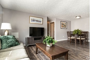 Wood Floor Living Room Wood Floor Living Room at Centerpointe Apartments, Canandaigua, NY - Photo Gallery 2