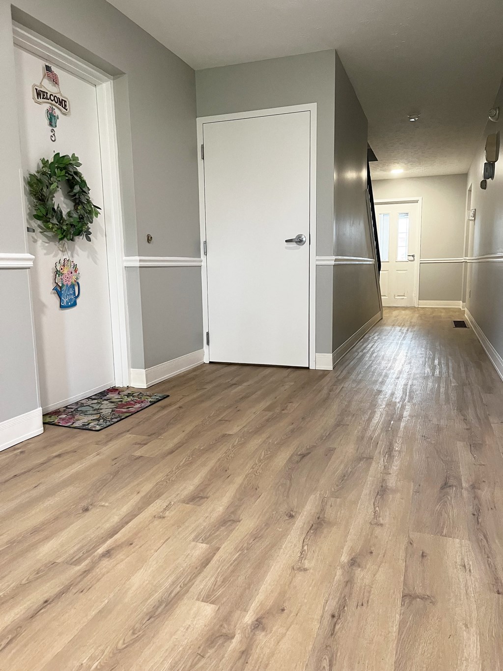 a picture of a hallway with hardwood floors and a white doorat Centerpointe Apartments, New York, 14424