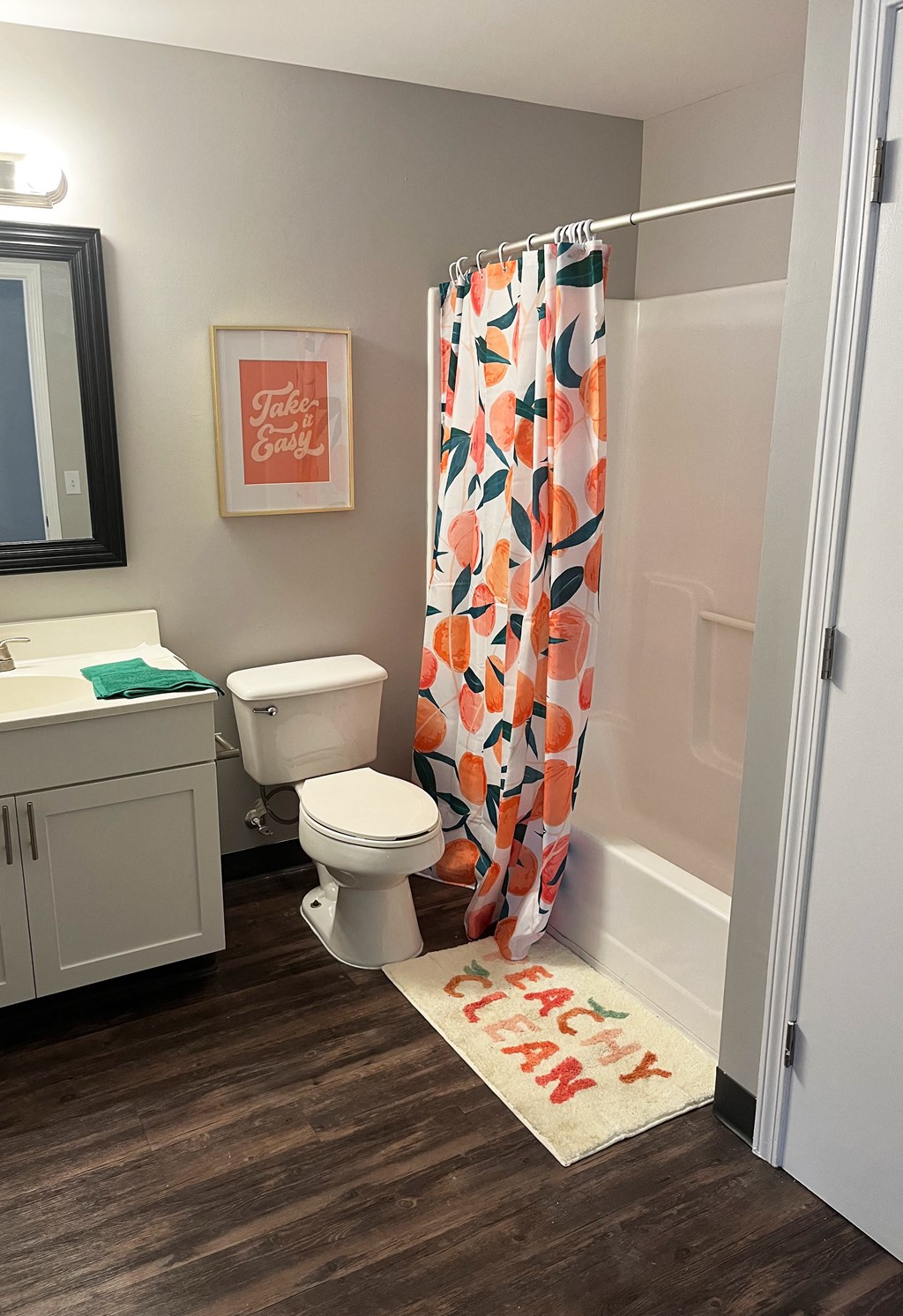 a bathroom with a shower toilet and sinkat Centerpointe Apartments, Canandaigua, New York