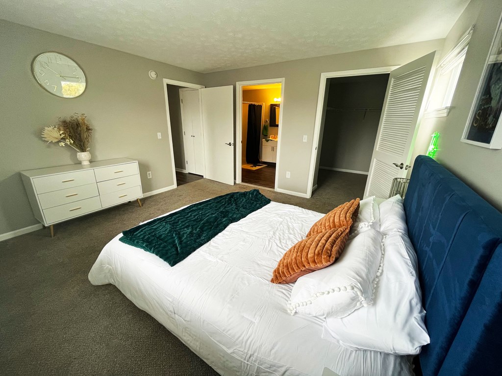 a bedroom with a bed and a dresserat Centerpointe Apartments, Canandaigua, NY, 14424