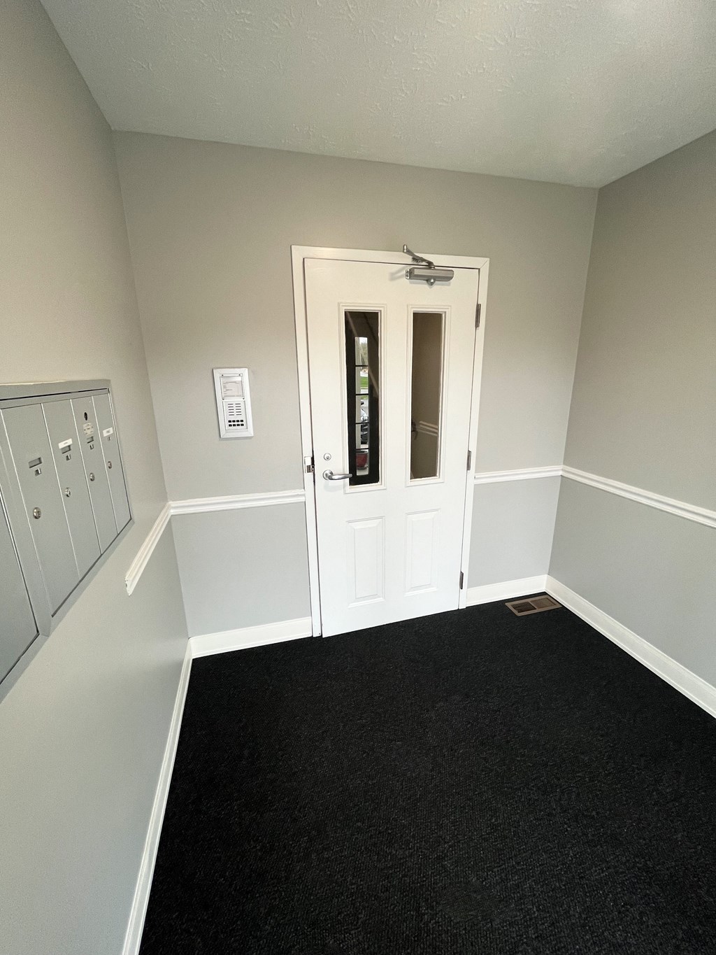a view of the front door from the inside of the buildingat Centerpointe Apartments, Canandaigua, NY