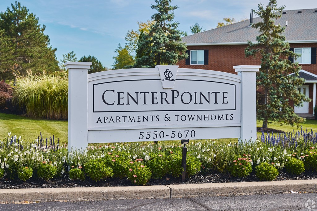 a sign for the centerpoint apartments and townhomes in front of a house at Centerpointe Apartments, Canandaigua, NY, 14424