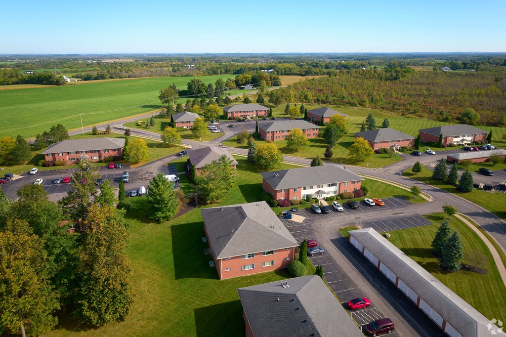 an aerial view of a neighborhood with houses and a parking lot at Centerpointe Apartments, Canandaigua, NY, 14424