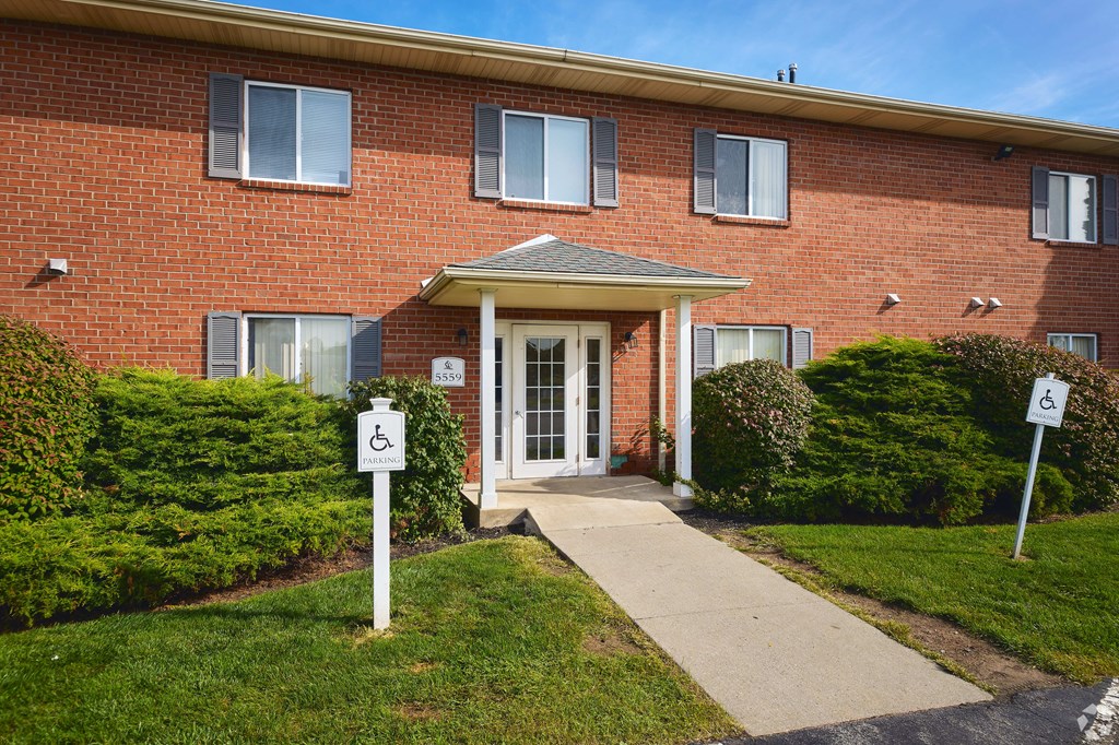 the front of a brick building with a walkway in front of the front door at Centerpointe Apartments, New York