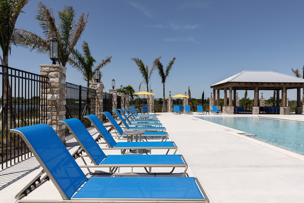 Pool Deck with Furniture at Cocoa Grand Apartments in Cocoa FL 32926