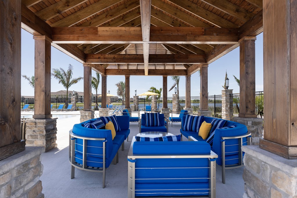 Pool Deck with Furniture at Cocoa Grand Apartments in Cocoa FL 32926
