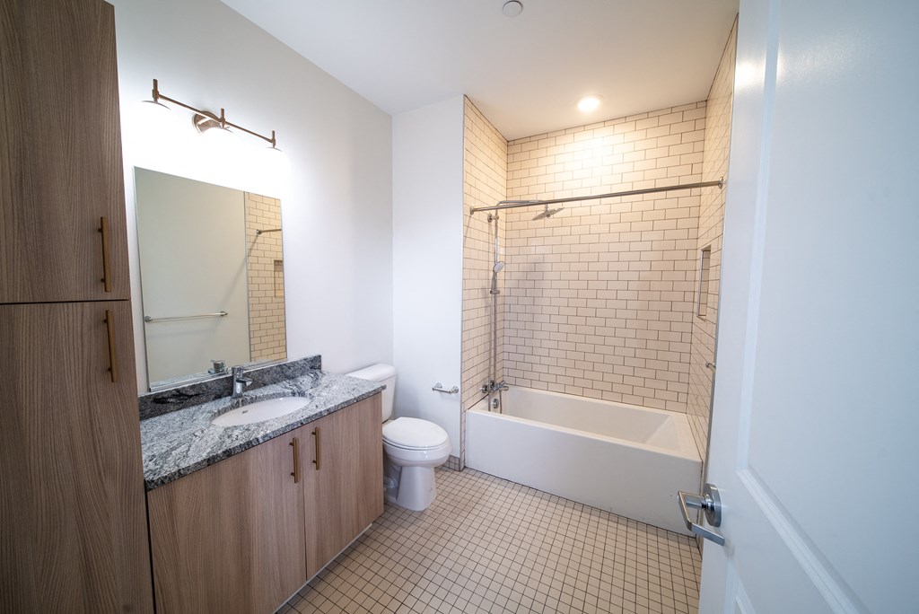 a bathroom with a sink toilet and a shower