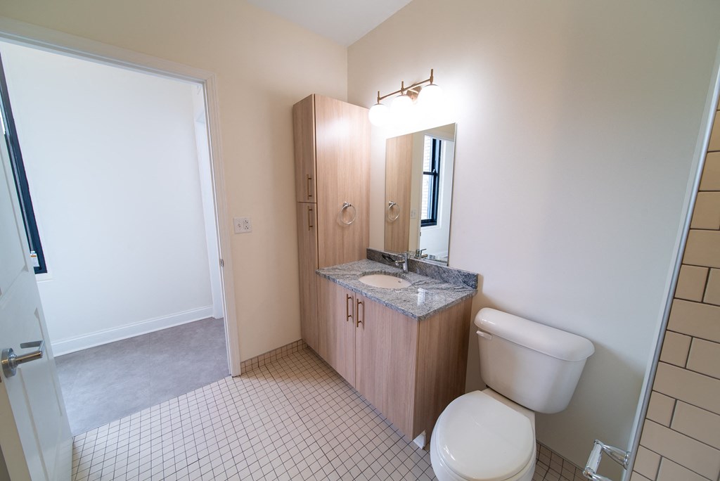an empty bathroom with a toilet and a sink