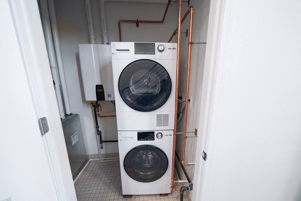 a washing machine and dryer in a room