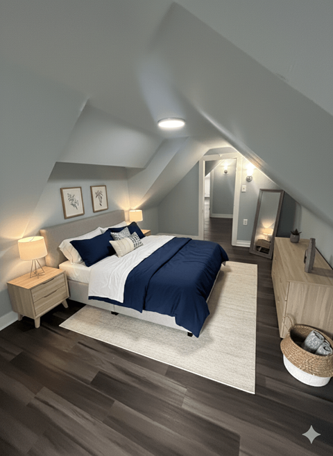 A bedroom with a bed, nightstand, and a basket on the floor.