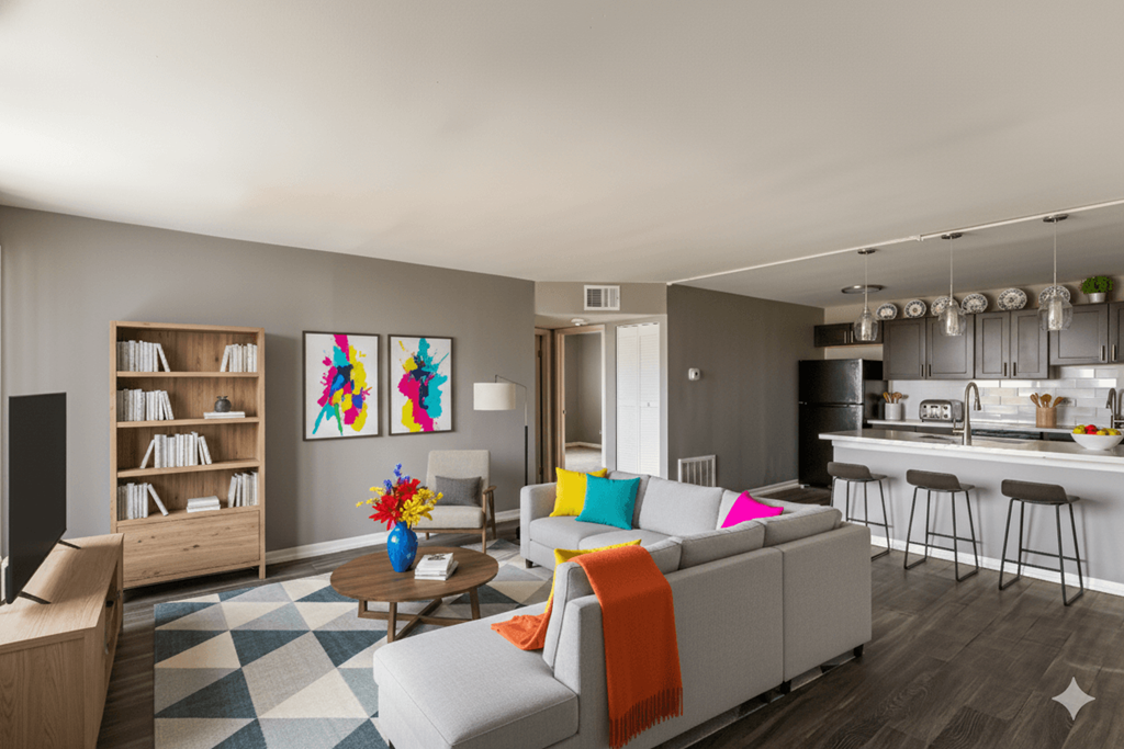 A living room with a grey couch and a coffee table.