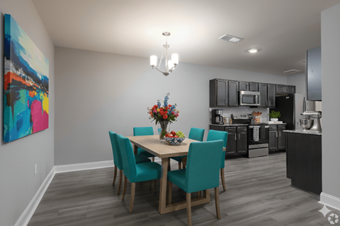 A dining room with a table set for four.