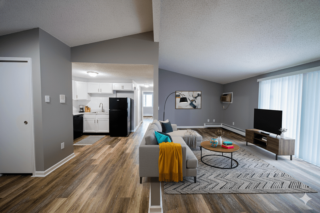 A living room with a grey couch and a coffee table.