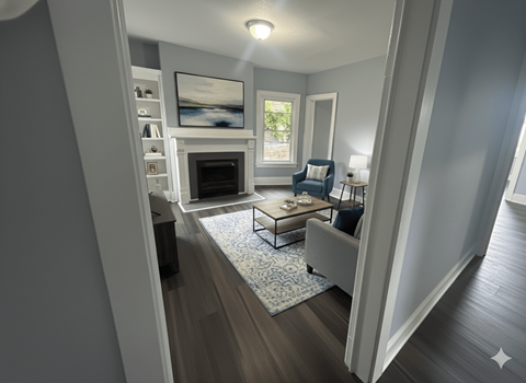 A modern living room with a fireplace and a painting on the wall.
