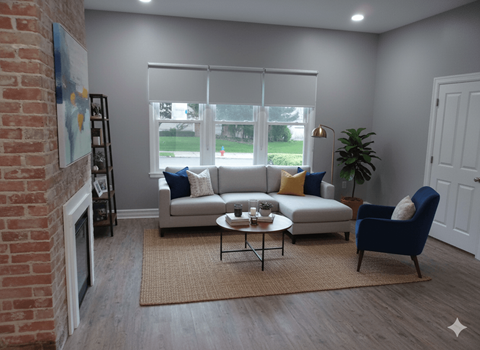 A living room with a brick fireplace and a couch.