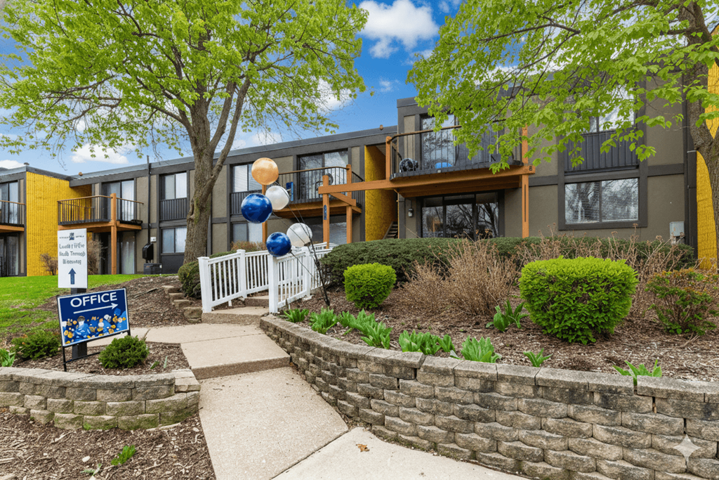 A building with a sign that says "OFFICE" in front of it.