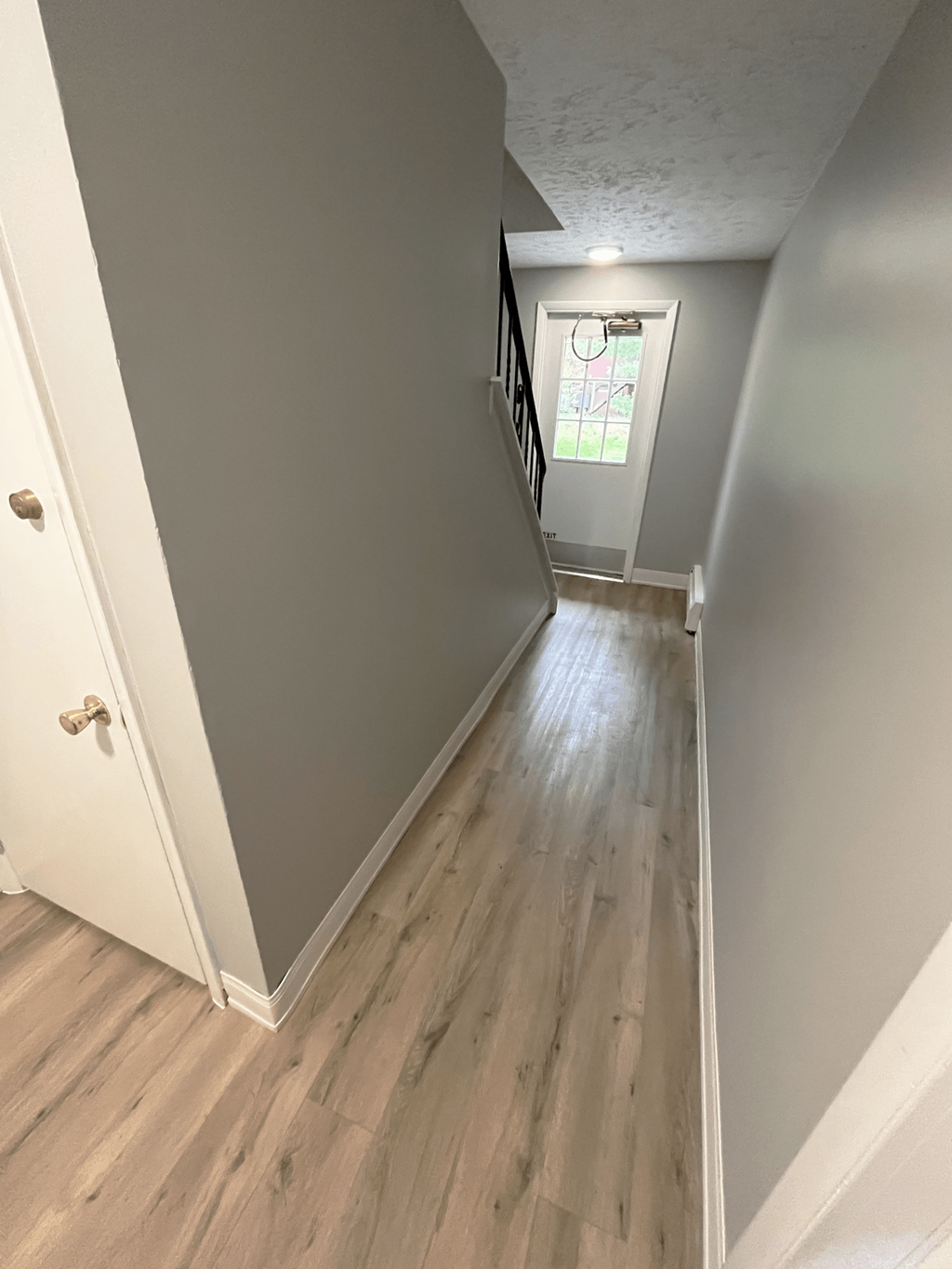 a view down the hallway from the top of the stairs at Highview Manor Apartments, Fairport, NY, 14450