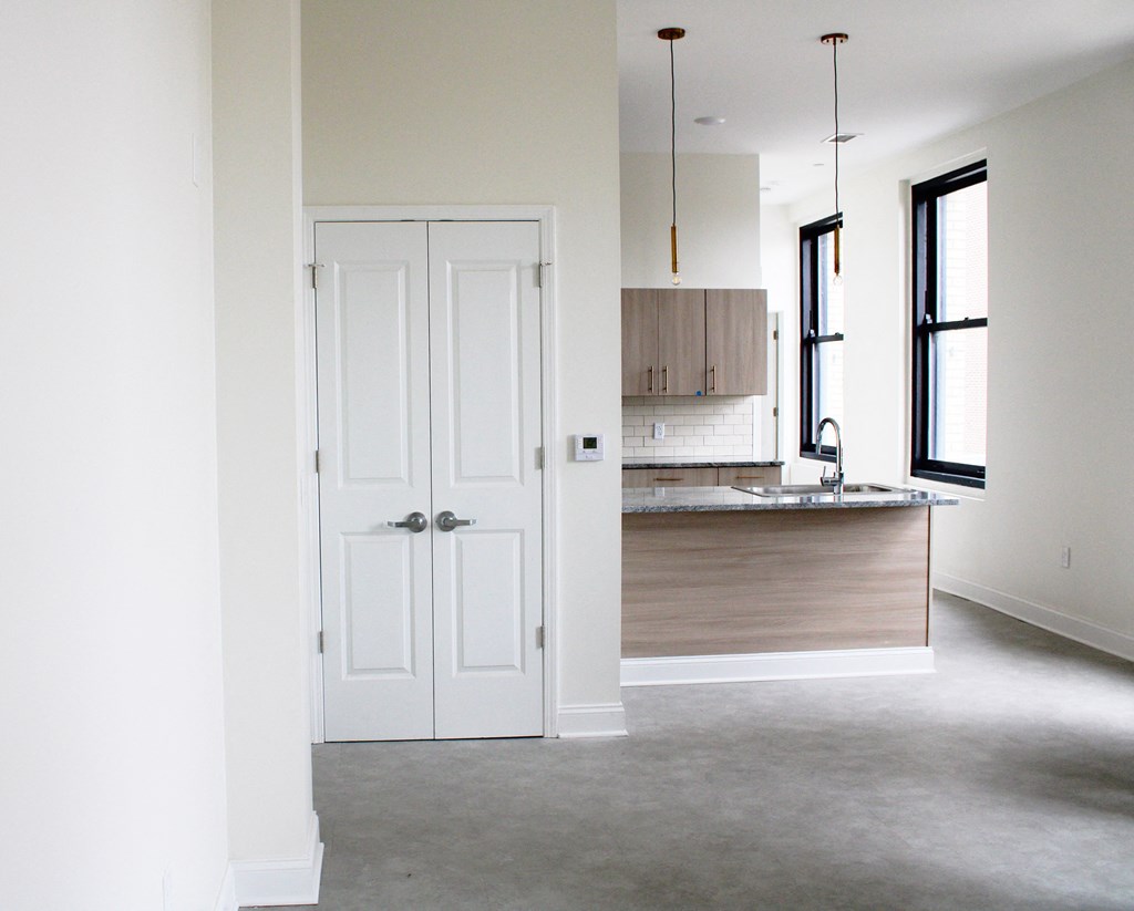 a white door in a kitchen with a counter top and