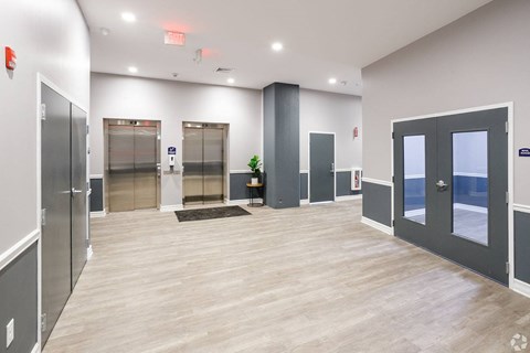 MAIL AND ELEVATOR AREA AT MID CITY APARTMENTS AT 1665 MAIN ST BUFFALO NY