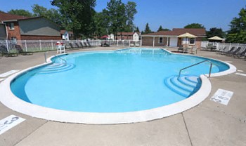 Swimming Pool With Relaxing Sundecks Swimming Pool With Relaxing Sundecks at Highview Manor Apartments, Fairport, New York - Photo Gallery 2