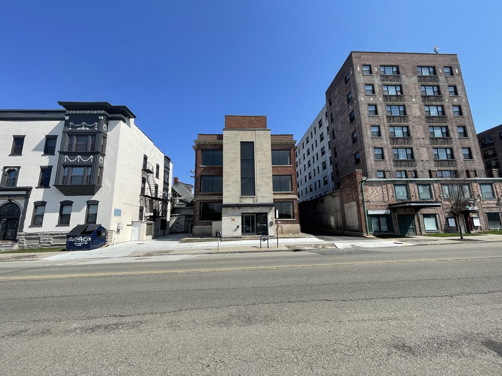 an old building on the corner of a city street