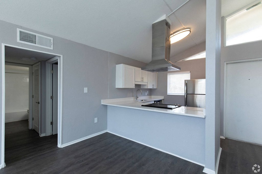 a kitchen and living room in a 555 waverly unit