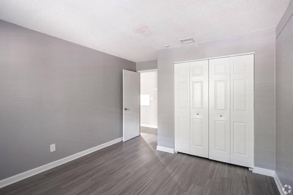 Renovated Apartment Home Bedroom at Fernwood Grove Apartments in Tampa Florida