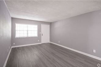 Renovated Living Room Area at Fernwood Grove Apartments in Tampa Florida - Photo Gallery 4