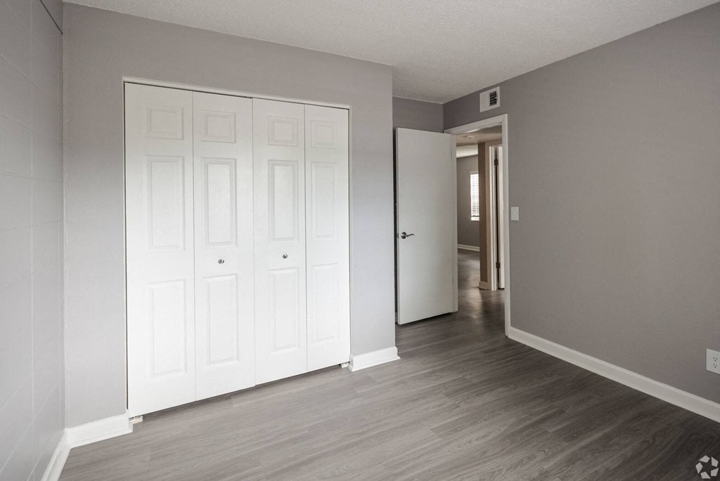 Renovated Apartment Home Bedroom Area at Fernwood Grove Apartments in Tampa Florida