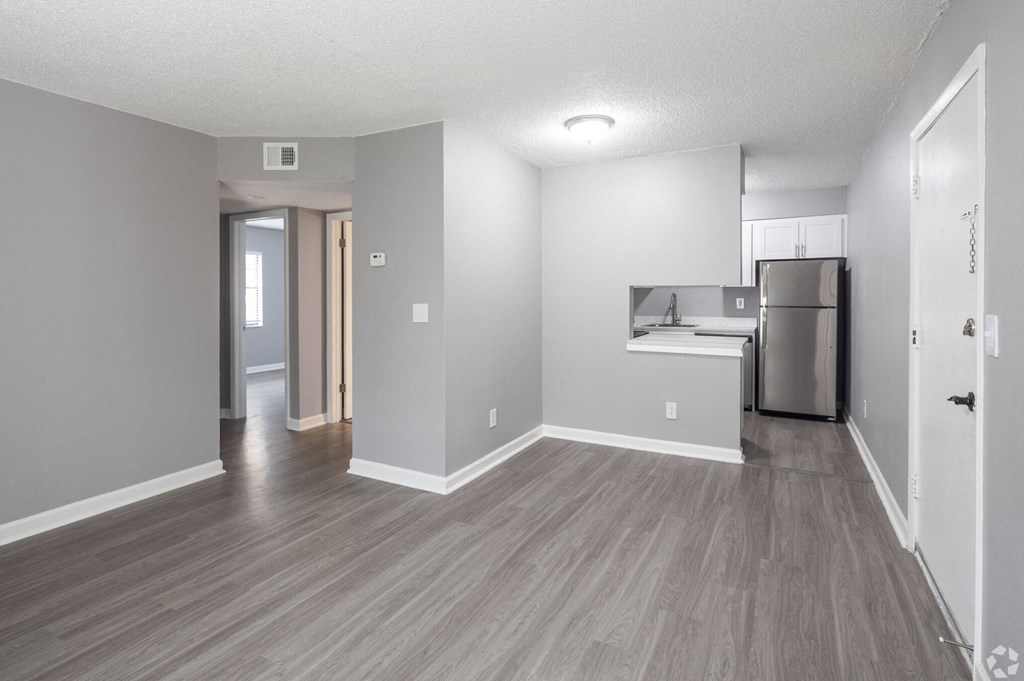 Renovated Apartment Home Living and Kitchen Areas at Fernwood Grove Apartments in Tampa Florida