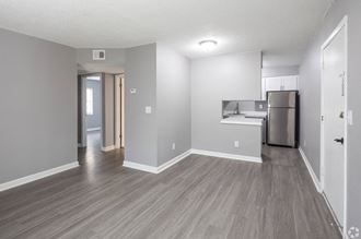 Renovated Apartment Home Living and Kitchen Areas at Fernwood Grove Apartments in Tampa Florida
