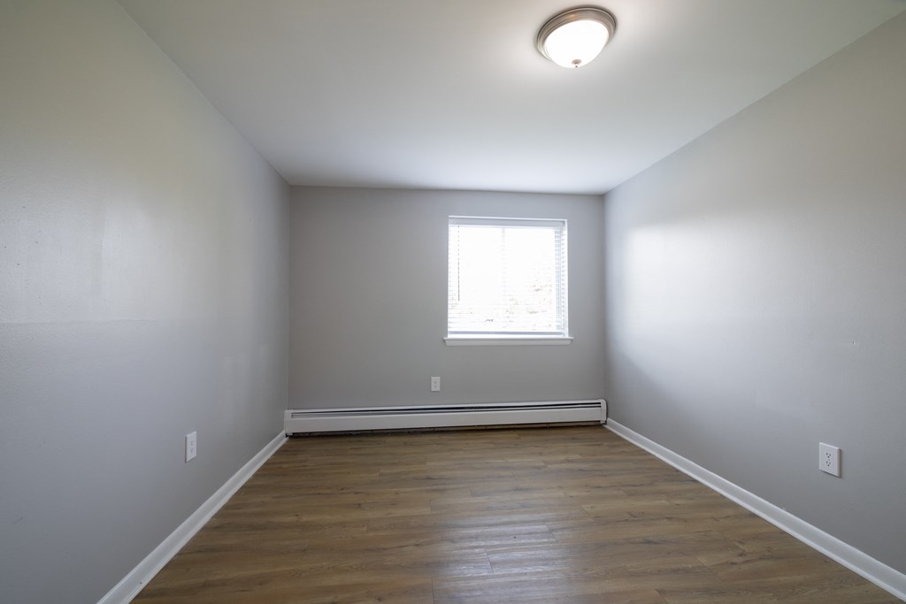 Renovated Bedroom with window light at Willowbrooke Apartments & Townhomes at 396 Willowbrooke Drive in Brockport, NY 14420