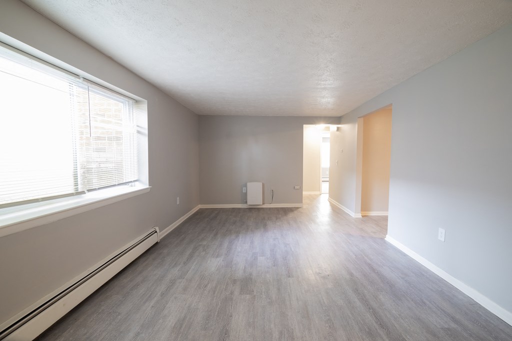 Renovated Living Room area  at Willowbrooke Apartments & Townhomes at 396 Willowbrooke Drive in Brockport, NY 14420