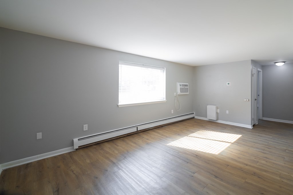 Renovated Living Room at Willowbrooke Apartments & Townhomes at 396 Willowbrooke Drive in Brockport, NY 14420