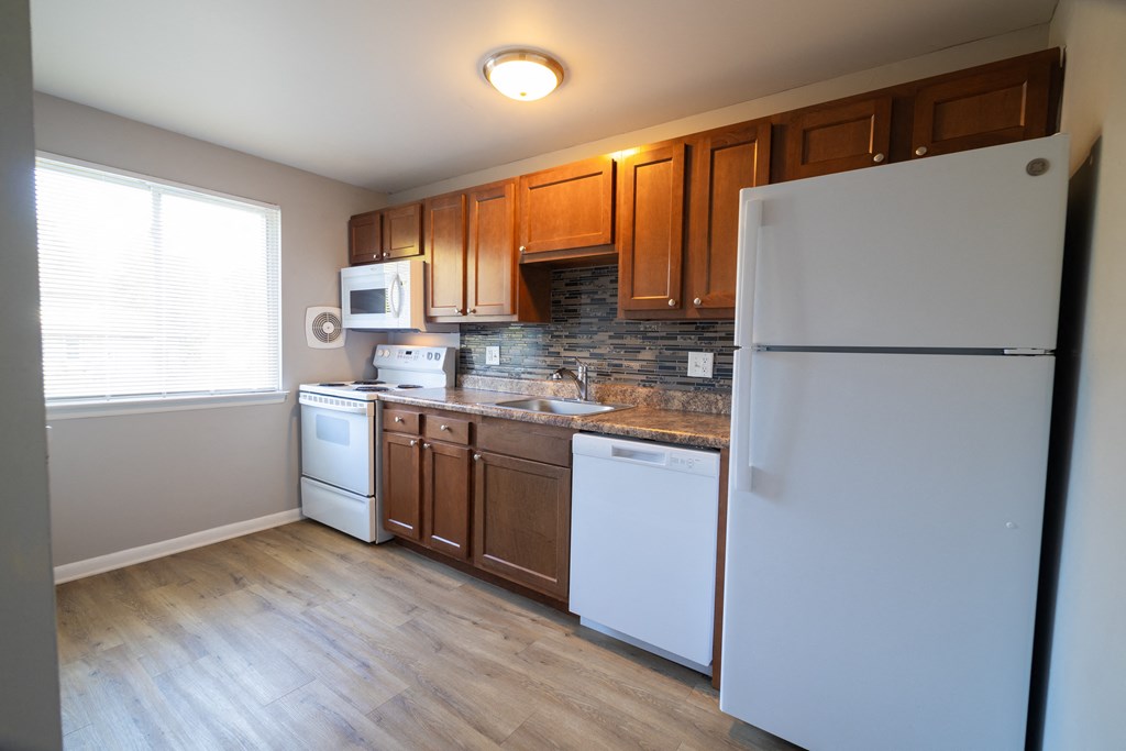 Kitchen with Refrigerator at Willowbrooke Apartments & Townhomes at 396 Willowbrooke Drive in Brockport, NY 14420